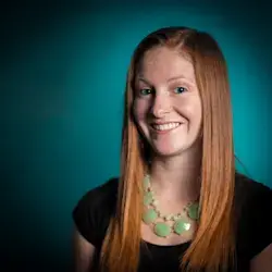 MigiHub interpreter sign language management software a woman with long red hair