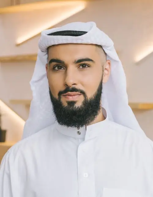 MigiHub interpreter sign language management, a man with a beard wearing a white headdress