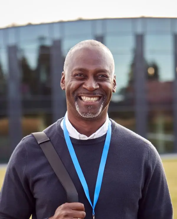 MigiHub interpreter sign language management, a man smiling at camera